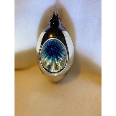 Olijf met zonnetje van het gekende Belgische merk Ajeko. 