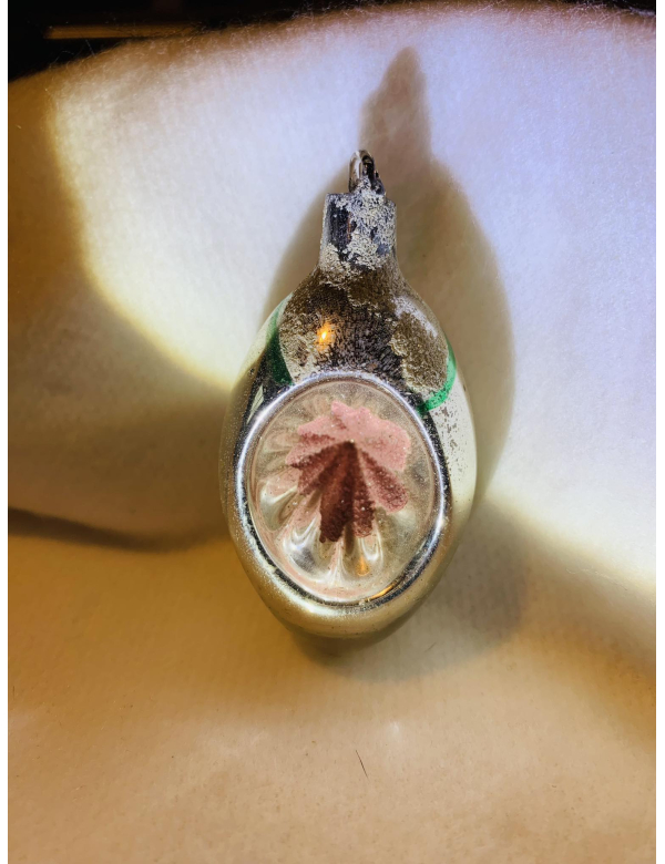 Olijf met zonnetje van het gekende Belgische merk Ajeko. 